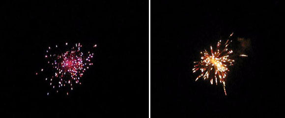 3-inch firework shells bursting in the night sky