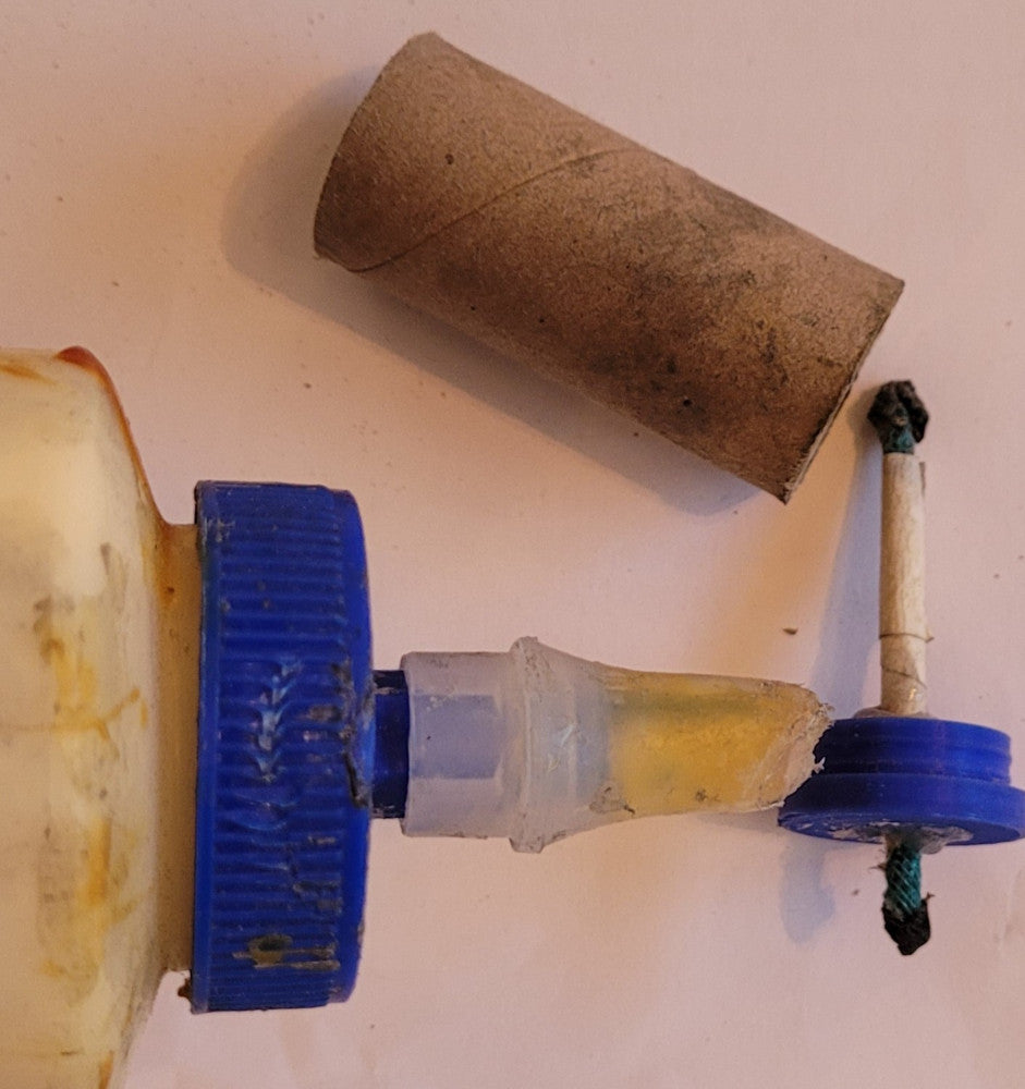 Gluing 3D printed fused plug into a mini fireworks shell with tite-bond