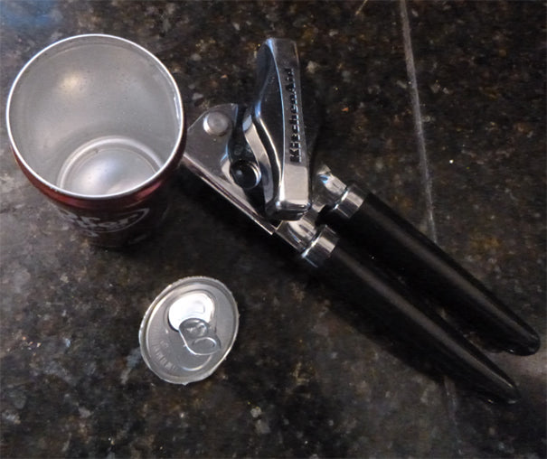 Soda can with top removed by can opener