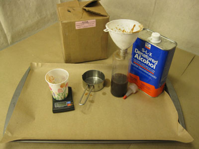 Supplies for dissolving red gum in denatured alcohol.