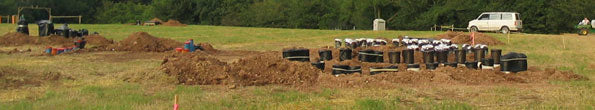 Large mortar tubes dug into the ground at the Pyrotechnics Guild International convention