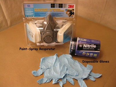 Safety equipment: a respirator and nitrile gloves.