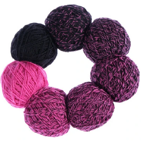 Ring of small balls of yarn in bright pink fading to dark purple.