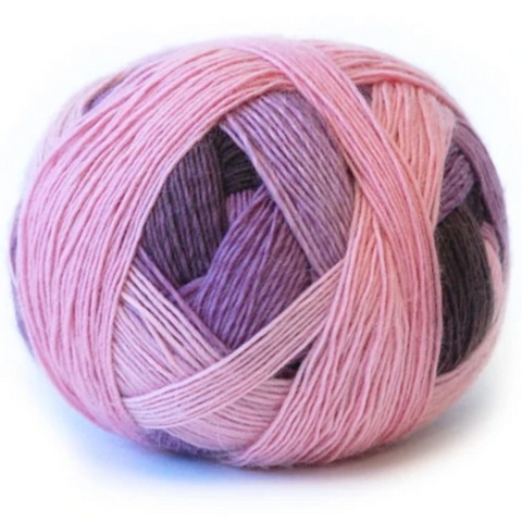 Ball of yarn in varying shades of pink and purple.