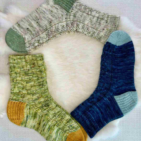 Three sock patterns designed by Megan Gonzalez for Summer of Socks KAL.