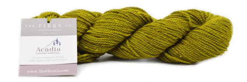 Skein of Acadia yarn from The Fibre Co. in a mossy yellow/green.