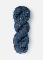 Skein of medium blue tweed yarn.