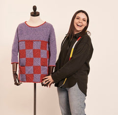 Designer Georgia Farrell stands with the two-color version of the Textured Tiles Sweater.