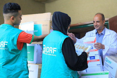 handing medical supplies to doctor