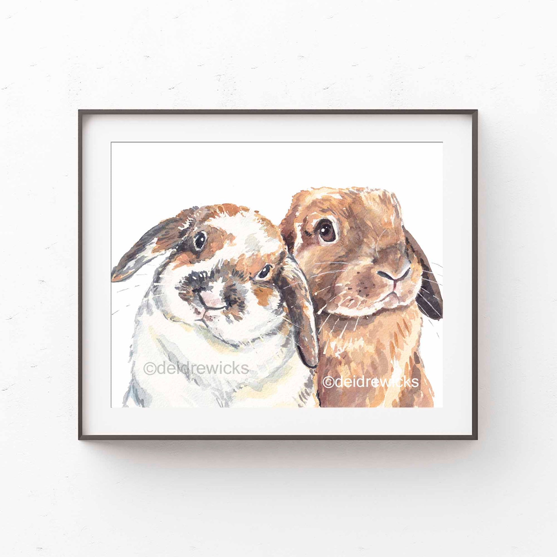 Framed example of a couple of brown and white lop eared bunny rabbits by Deidre Wicks