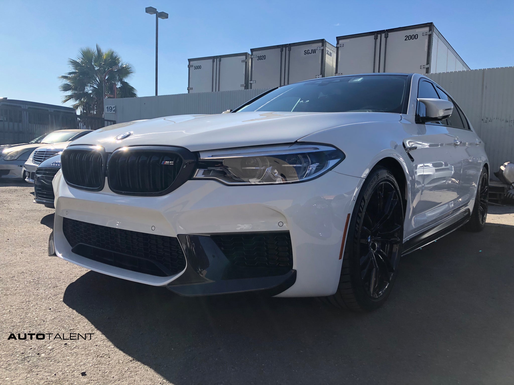 Alpine White BMW F90 M5 with Akrapovic Exhaust + M Performance