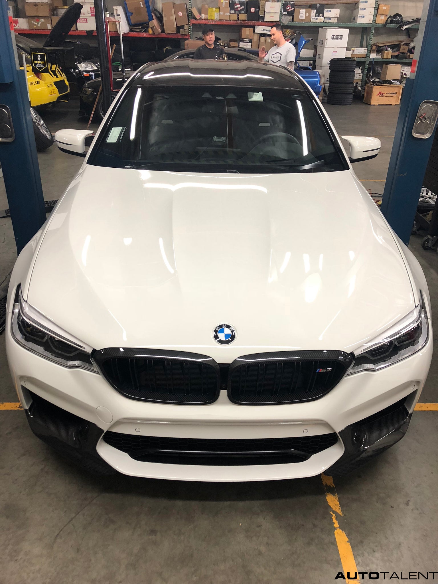 BMW F90 M5 on lift to get Akrapovic evolution installed exhaust 