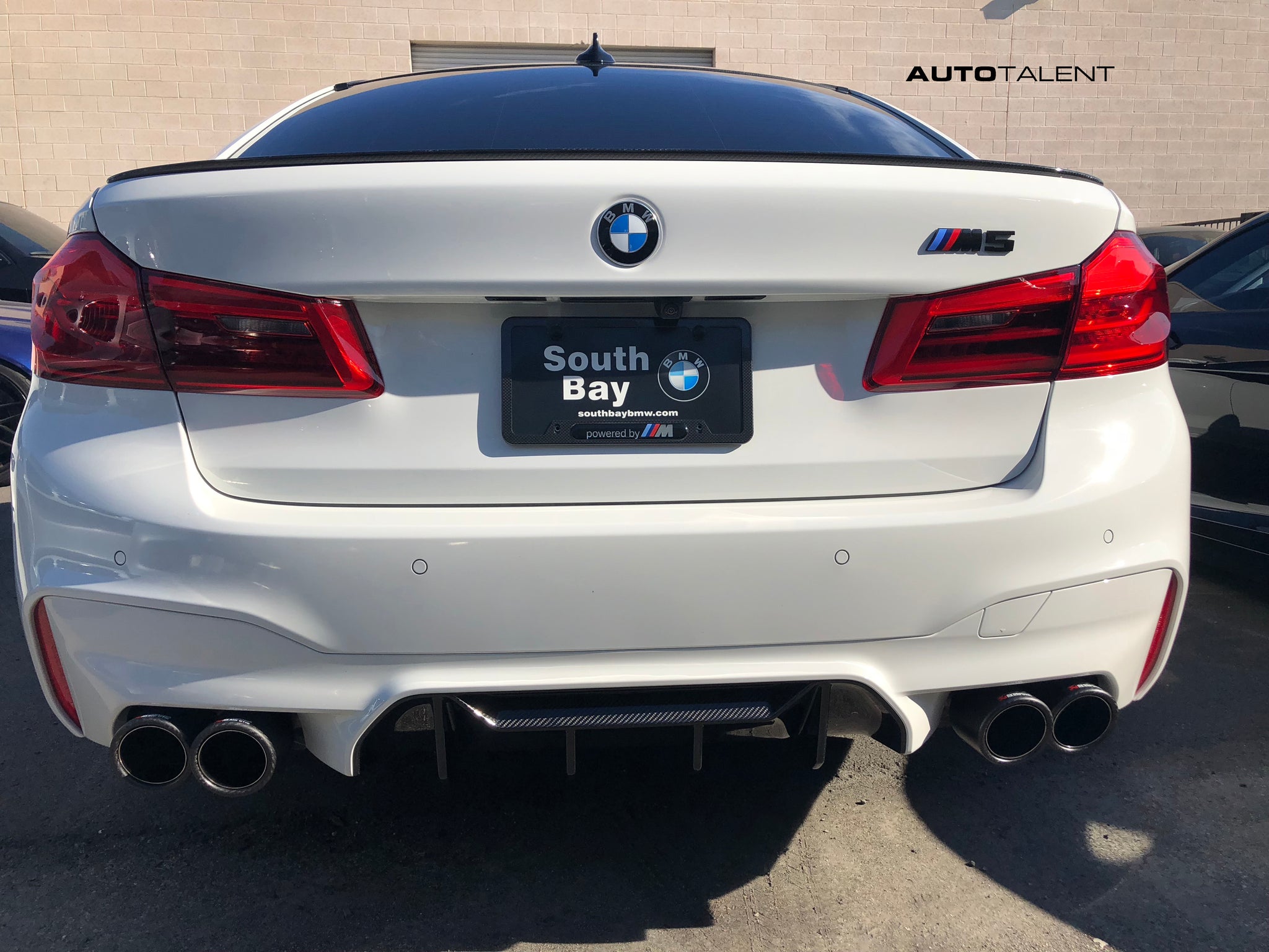 White F90 M5 with Akrapovic Exhaust and M Performance Rear Spoiler