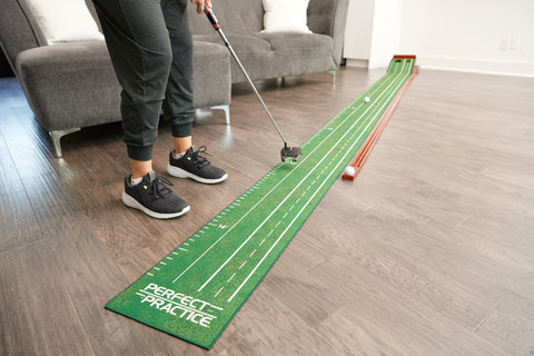 golfer practicing on the perfect putting mat xl edition