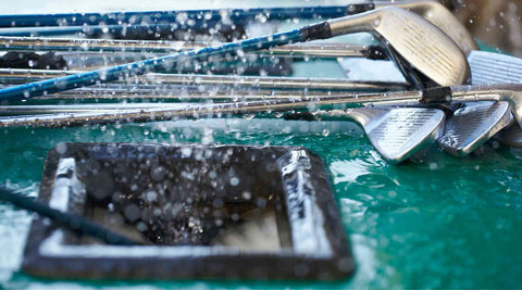 washing a complete set of golf clubs