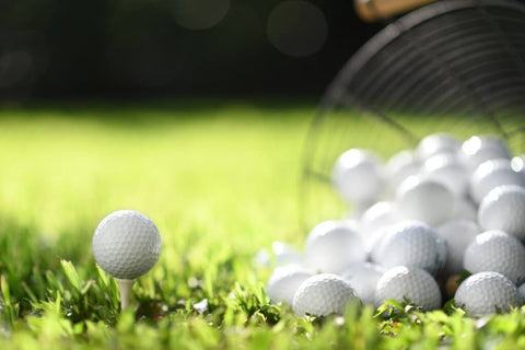 Beginner golf balls dumped out of a basket