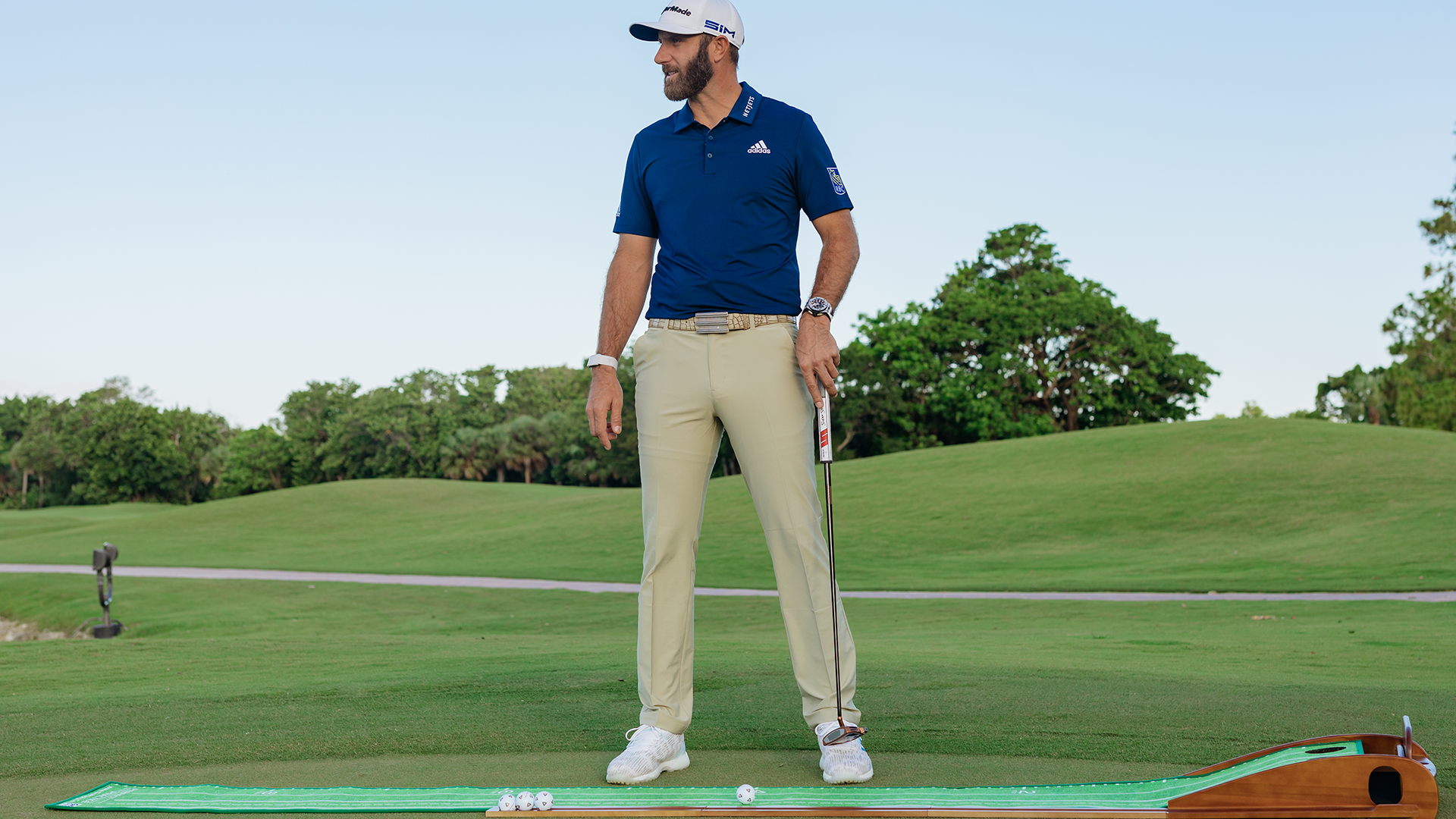 Dustin Johnson on golf course using Perfect Practice putting mat