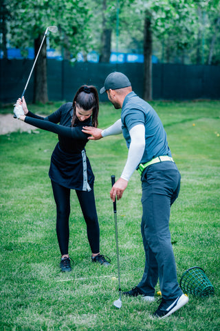 golf swing lesson with female golfer