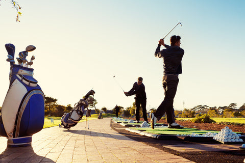 golfers practicing on driving range