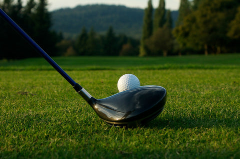 golf tee shot with driver golf club