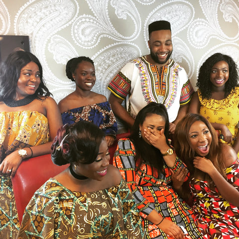 Group of people wearing vibrant african print ankara outfits