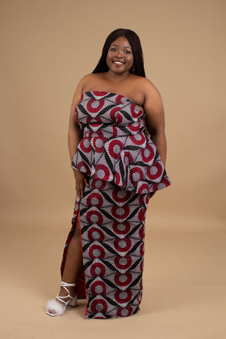Plus size woman in Adeola African print peplum dress