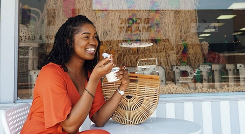 Woman Smiling and Eating