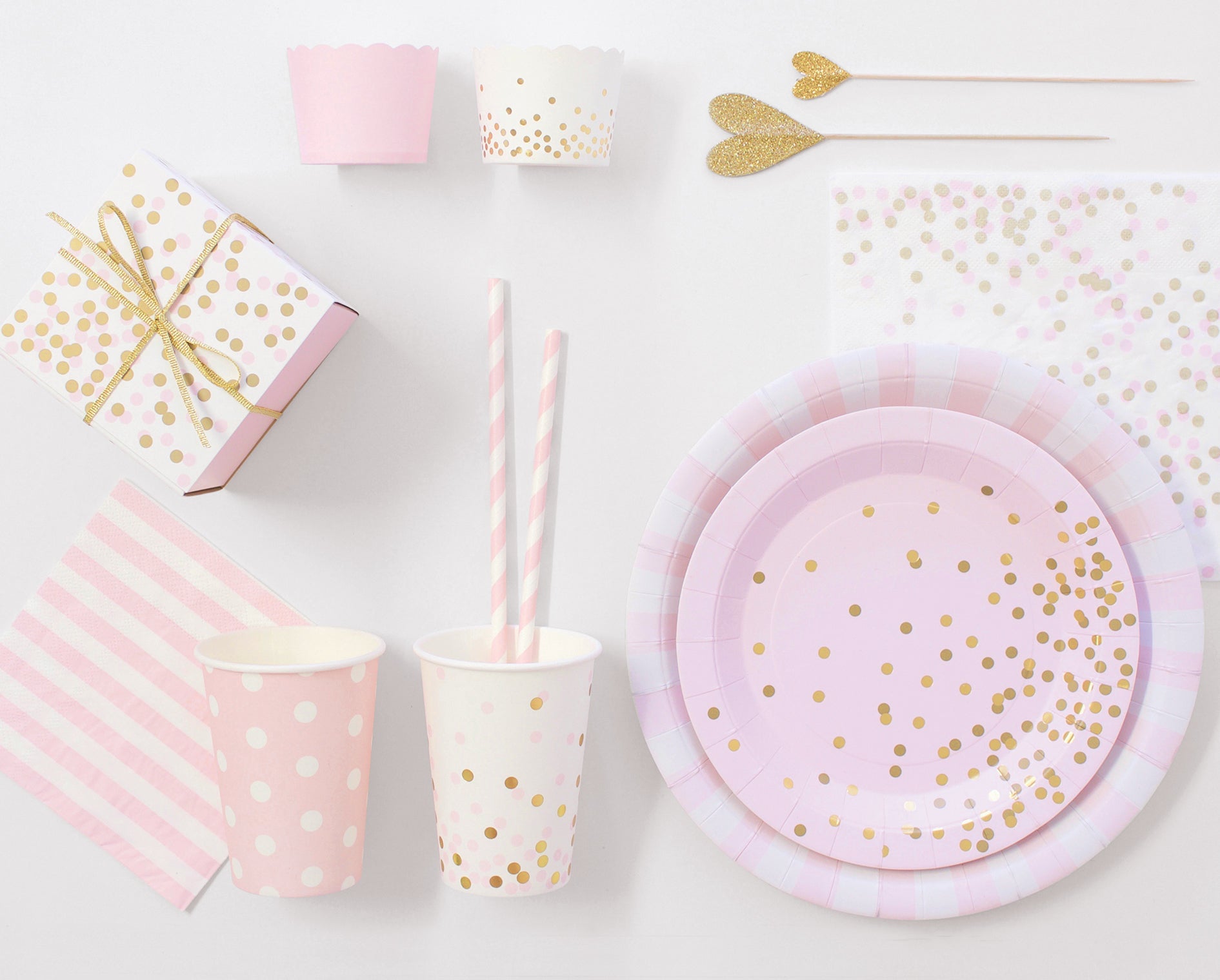 pink paper cups and plates