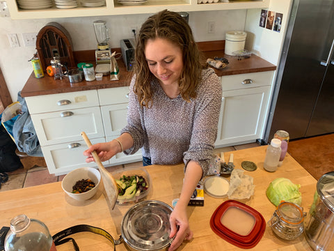 Genevieve cooking with reusable tupperwares 