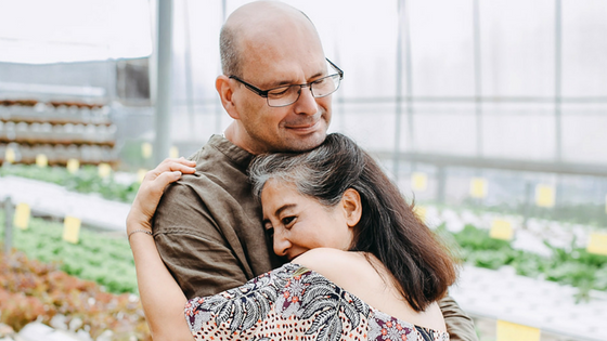 Couple hugging and smiling