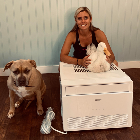 Woman with her pets and the TOSOT Window Air Conditioner