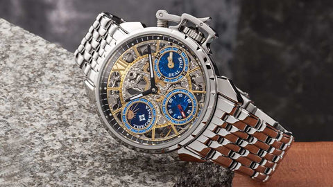 Oman Theorema mechanical watch for men, silver case and metal bracelet, skeleton dial, blue sub-dials, dual-time function, black and white stick hands