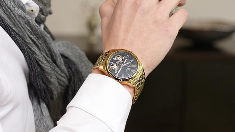 Tufina Dubai Theorema, German watch for men with a mechanical movement, gold case and bracelet, sleek black dial, Roman numerals