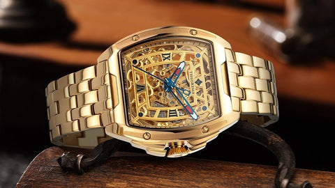 Tufina Theorema St. Petersburg, German watch for men with an IPG gold plated case, skeleton dial and hands, Roman numerals, square case and metal bracelet
