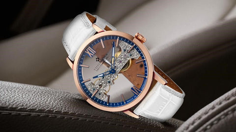 Tufina Theorema San Francisco, a limited edition mechanical watch with a skeleton dial, rose gold case, Roman and stick numerals, skeleton two-colored hands and blue details