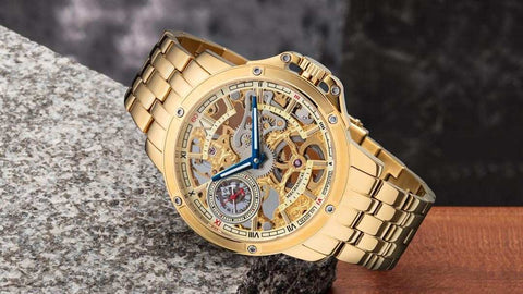 Tufina Theorema Lagos, IPG gold plated watch for men, German skeleton watch with blue hands and a metal bracelet