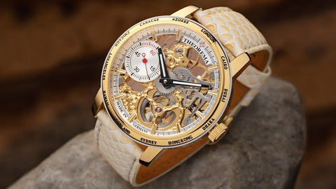 Tufina Theorema Toronto Mechanical Watch for Men, gold case watch with a skeleton dial and world timer bezel