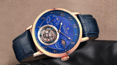 Tufina Pionier Basel Tourbillon, automatic tourbillon watch for men with a rose gold case, blue dial, blue leather band, open heart window, Arabic breguet numerals, dual-time function