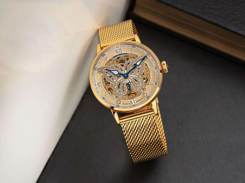 Tufina Madame Butterfly Theorema GM-123-8 automatic watch for women with a butterfly themed skeleton dial, 82 Swarovski diamonds and gold metal mesh bracelet