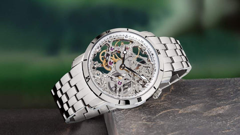 This is Tufina's Rio GM-107-5 watch from the Theorema collection, a silver watch for men with a stainless steel case and bracelet, mechanical movement with 17 jewels and skeleton dial.