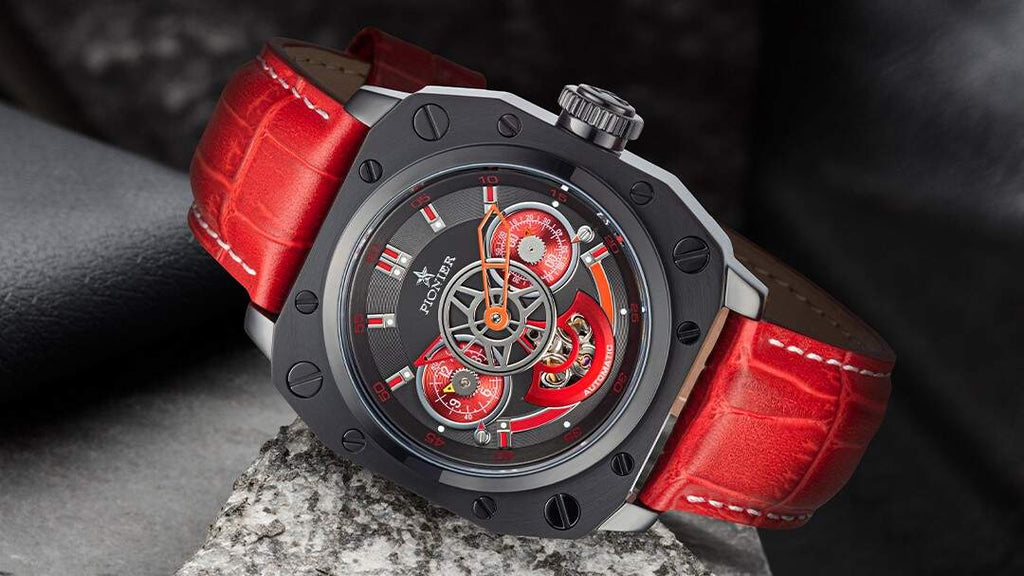 This is Tufina Newport Pionier P7003-6 watch, a modern styled automatic watch for men with a red leather band and black two-tone dial, dual-time function, skeletonized hands and 5 ATM water resistance.