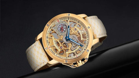 This is Tufina's Lagos GM-113-3 watch from the Theorema collection, a mechanical watch for men with a skeleton dial, stainless steel case in gold and cream leather band with a fish skin pattern.