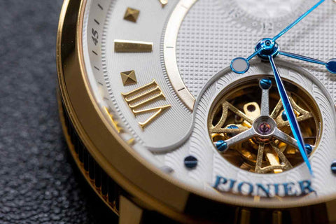 Tufina Boston by Pionier Germany, automatic watch for men with white dial, golden case, brown leather band, thin blue hands, open heart window and Roman numerals