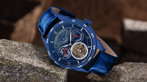 This is a watch from Tufina's Pionier collection, Geneva Tourbillon GM-902-10 - an automatic co-axial tourbillon with a blue dial, open heart window, leaf hands, real blue leather band.