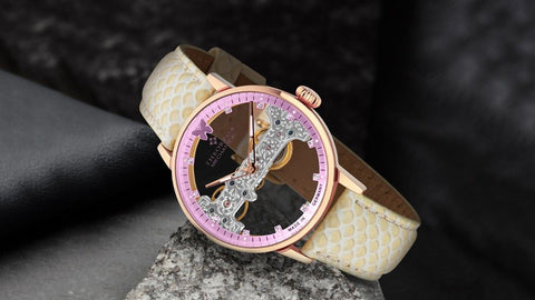 Tufina Theorema Lady Butterfly GM-120-6 mechanical watch for women with a pink and silver skeleton dial, white leather band and 11 Swarovski crystals