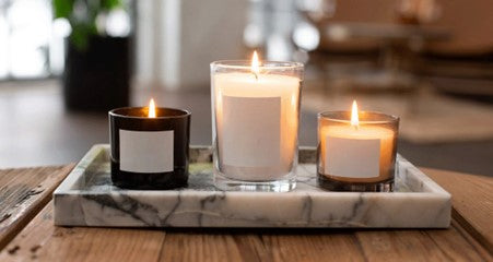 Combining candles on side tables will add depth and texture to your space.