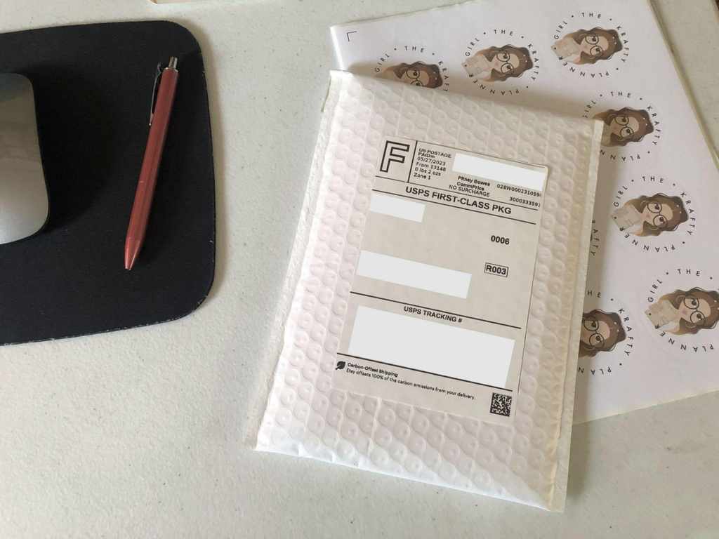Attach the printed Etsy shipping label to the parcel.