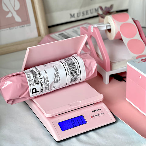 Weigh your packages with the MUNBYN pink postal scale.