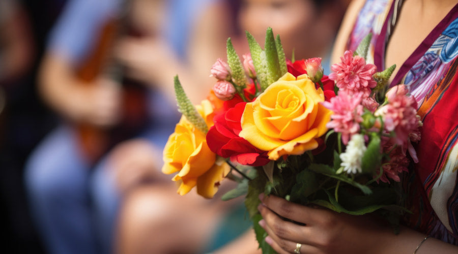 Close-up of a rose bouquet held by a person