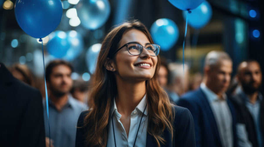 Woman with balloon at an Administrative Professionals Day celebration